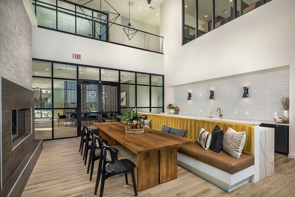 Clubhouse with modern design and seating areas at Revel Apartments