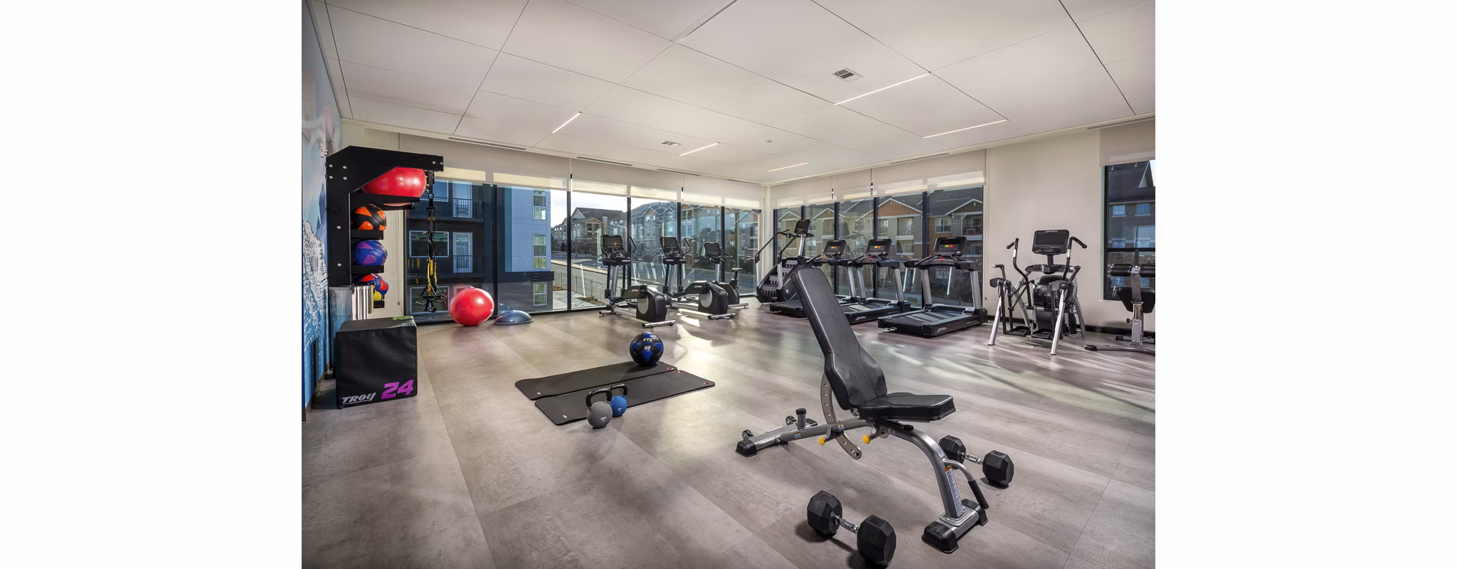 Revel Apartments: Modern fitness center with state-of-the-art equipment for active living