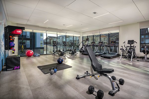 Revel Apartments: Modern fitness center with state-of-the-art equipment for active living