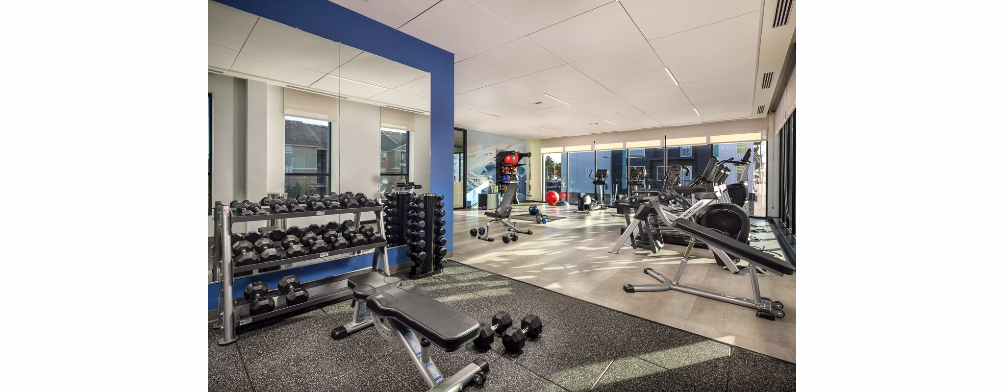 Well-equipped fitness center with modern machines at Revel Apartments, a Greystar community focused on luxury and comfort