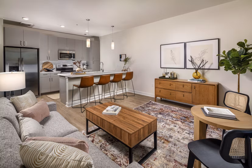 Spacious living room with modern furnishings at Revel Apartments, a luxury complex ideal for comfortable living moments