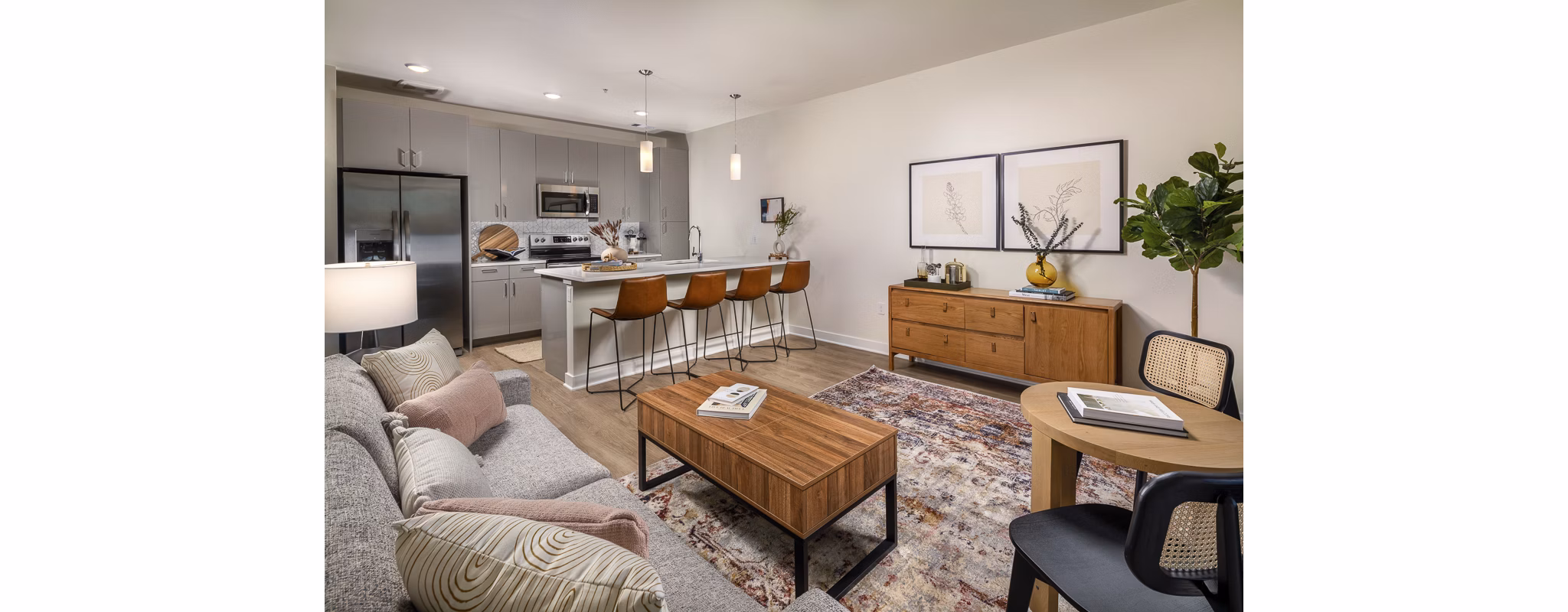 Spacious living room with modern furnishings at Revel Apartments, a luxury complex ideal for comfortable living moments