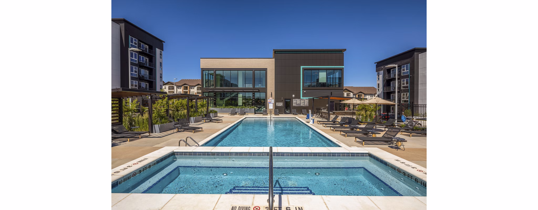 Rooftop pool offering cityscape views at Revel Apartments