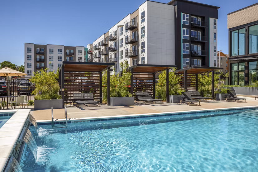 Sparkling pool at Revel Apartments offering luxury relaxation and recreation
