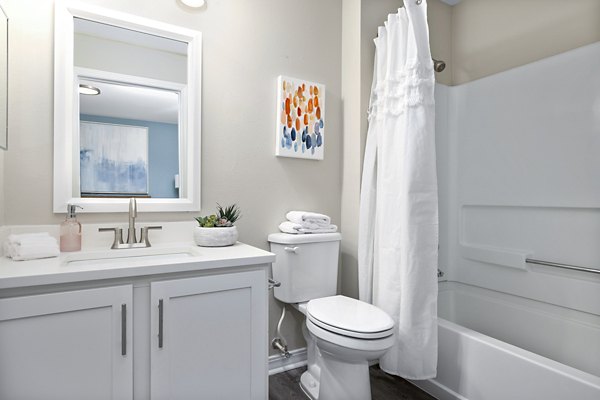 Modern bathroom with sleek fixtures in 403 West TEST Apartments, luxury living in a prime location