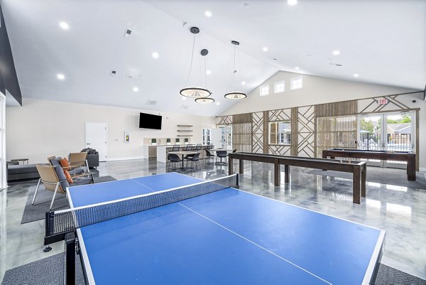 Clubhouse game room with billiards and lounge seating at 403 West Apartments, a Greystar luxury apartment community