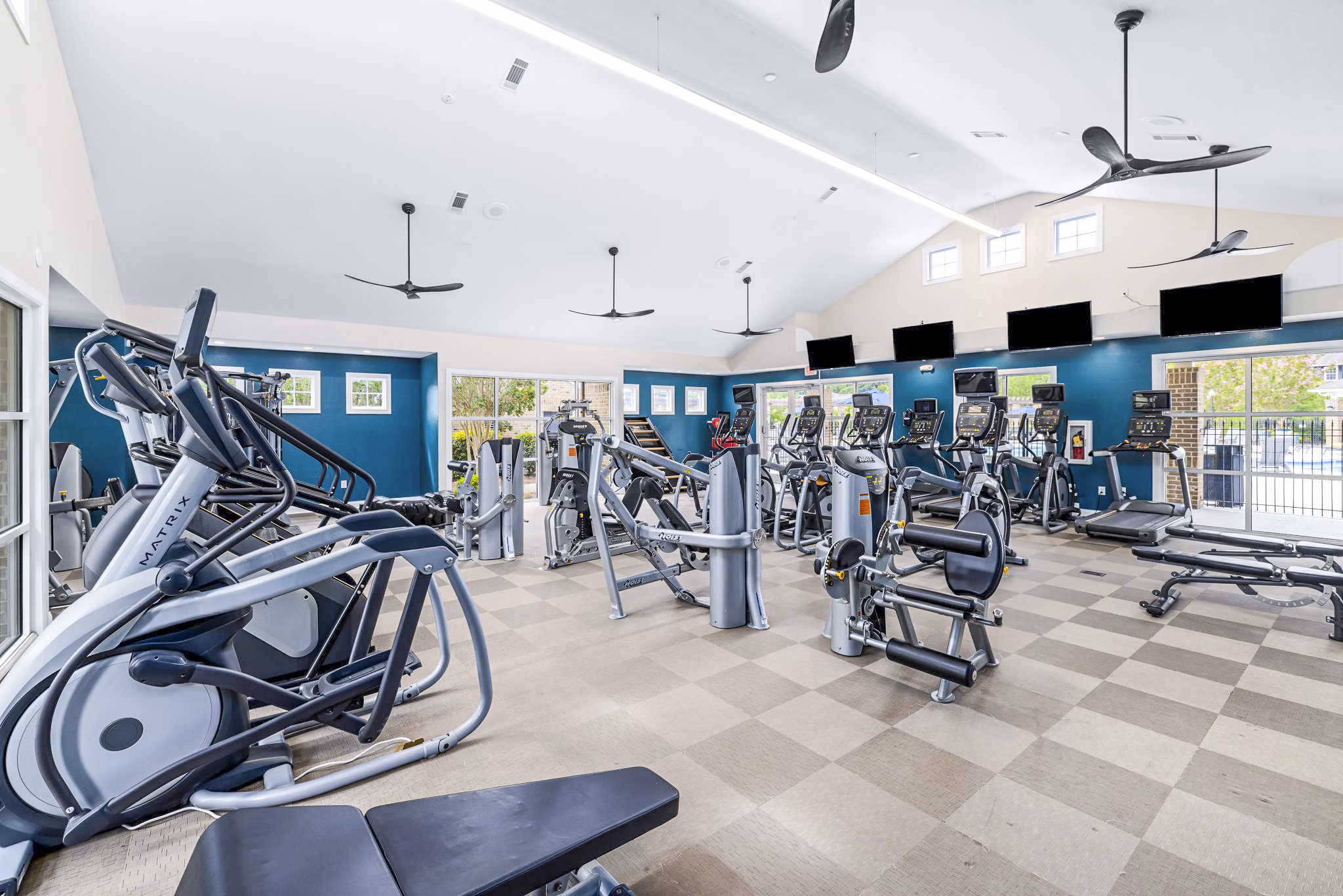 Modern fitness center with state-of-the-art equipment at 403 West Apartments offering a comprehensive workout experience for residents
