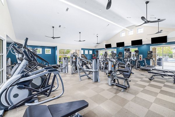 Modern fitness center with state-of-the-art equipment at 403 West Apartments offering a comprehensive workout experience for residents
