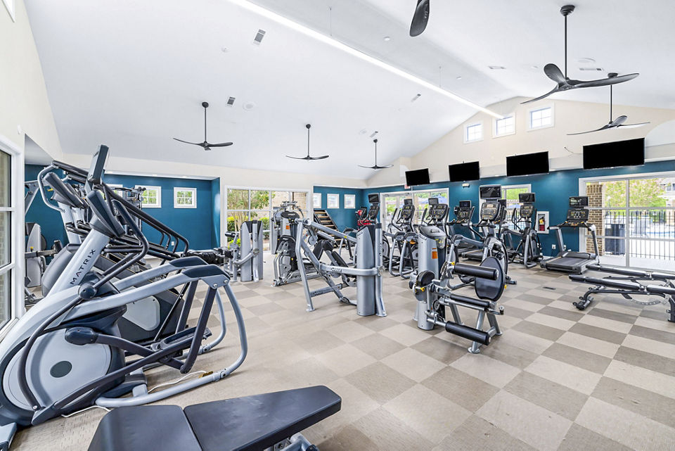 Modern fitness center with state-of-the-art equipment at 403 West Apartments offering a comprehensive workout experience for residents