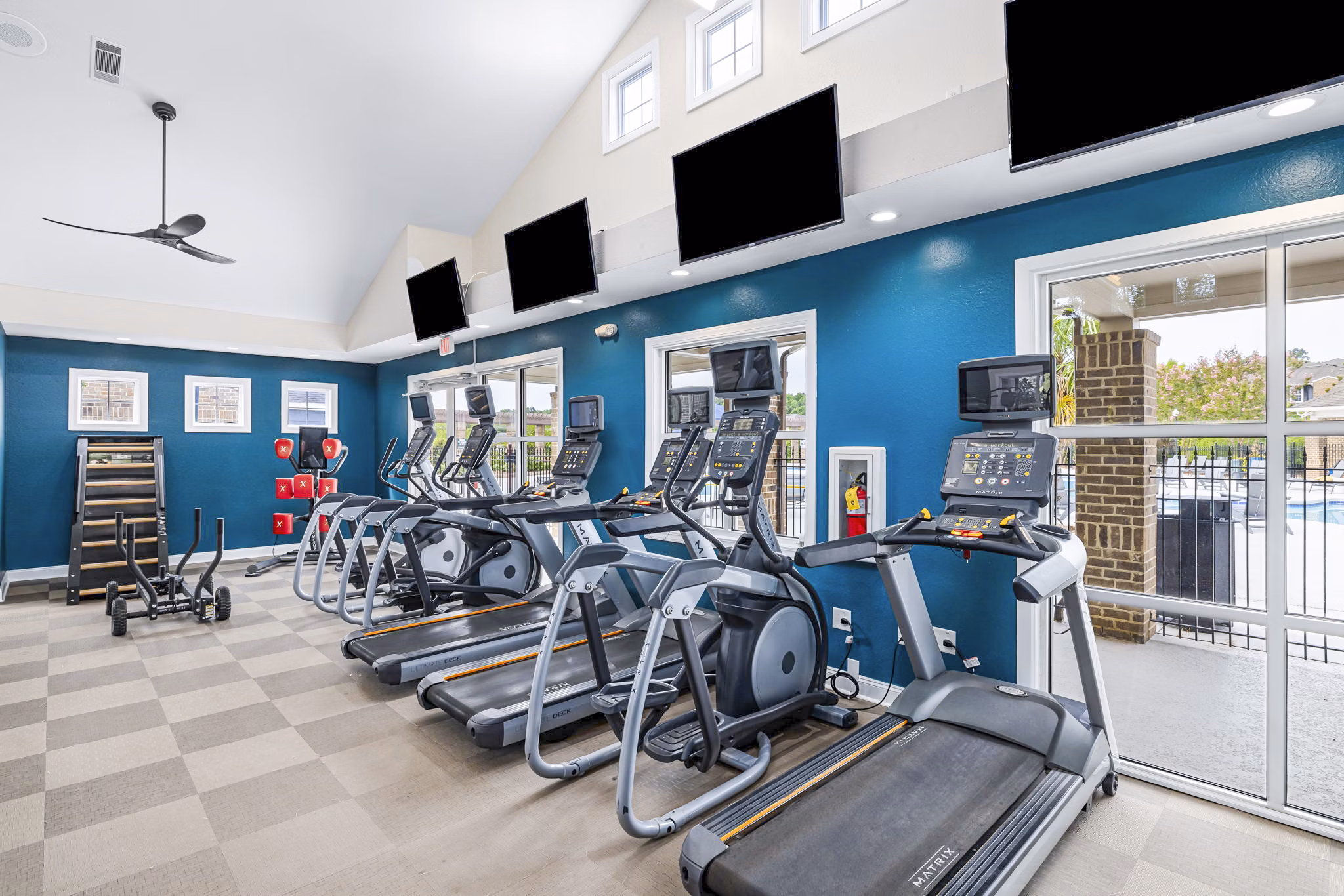 State-of-the-art fitness center with modern equipment at 403 West Apartments, ideal for luxury lifestyle living