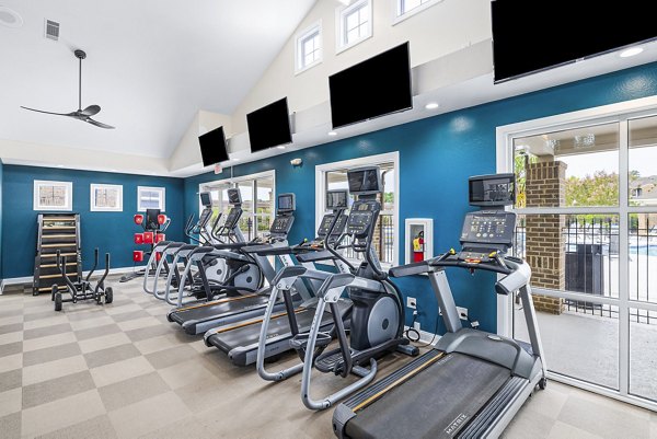 State-of-the-art fitness center with modern equipment at 403 West Apartments, ideal for luxury lifestyle living