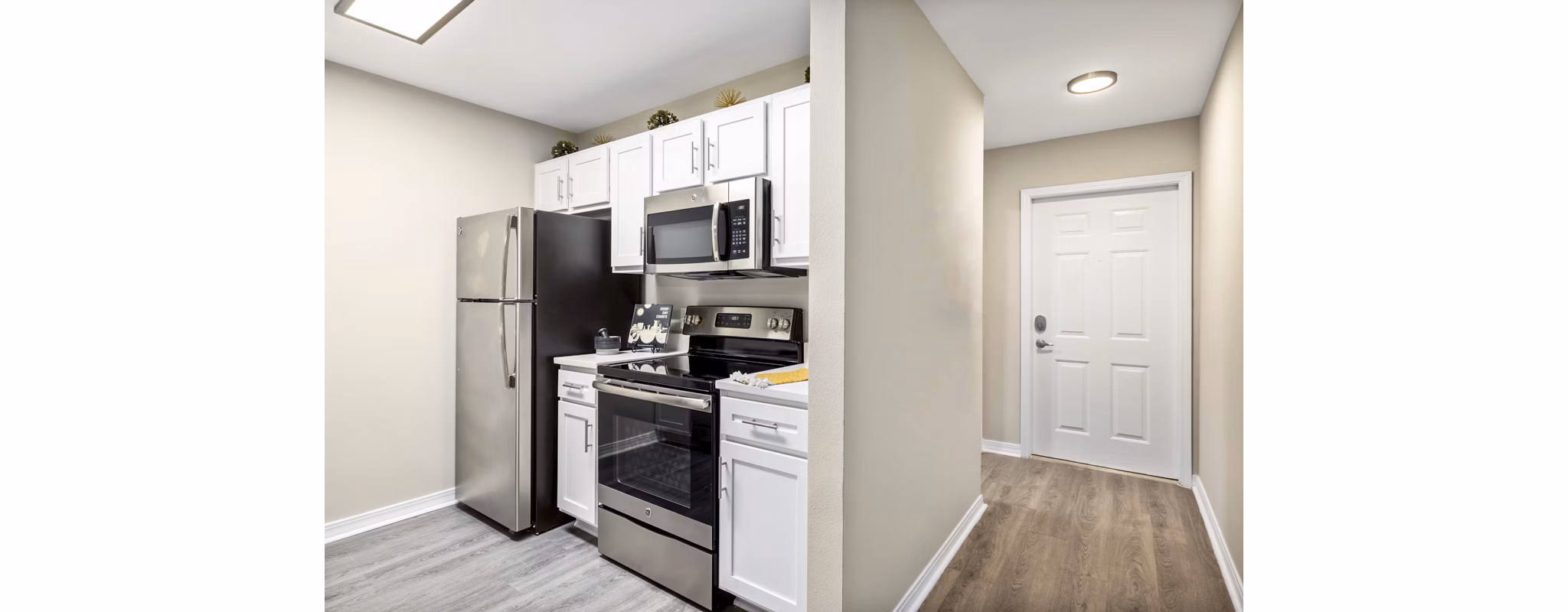 Modern kitchen featuring sleek countertops and stainless steel appliances at 403 West Apartments