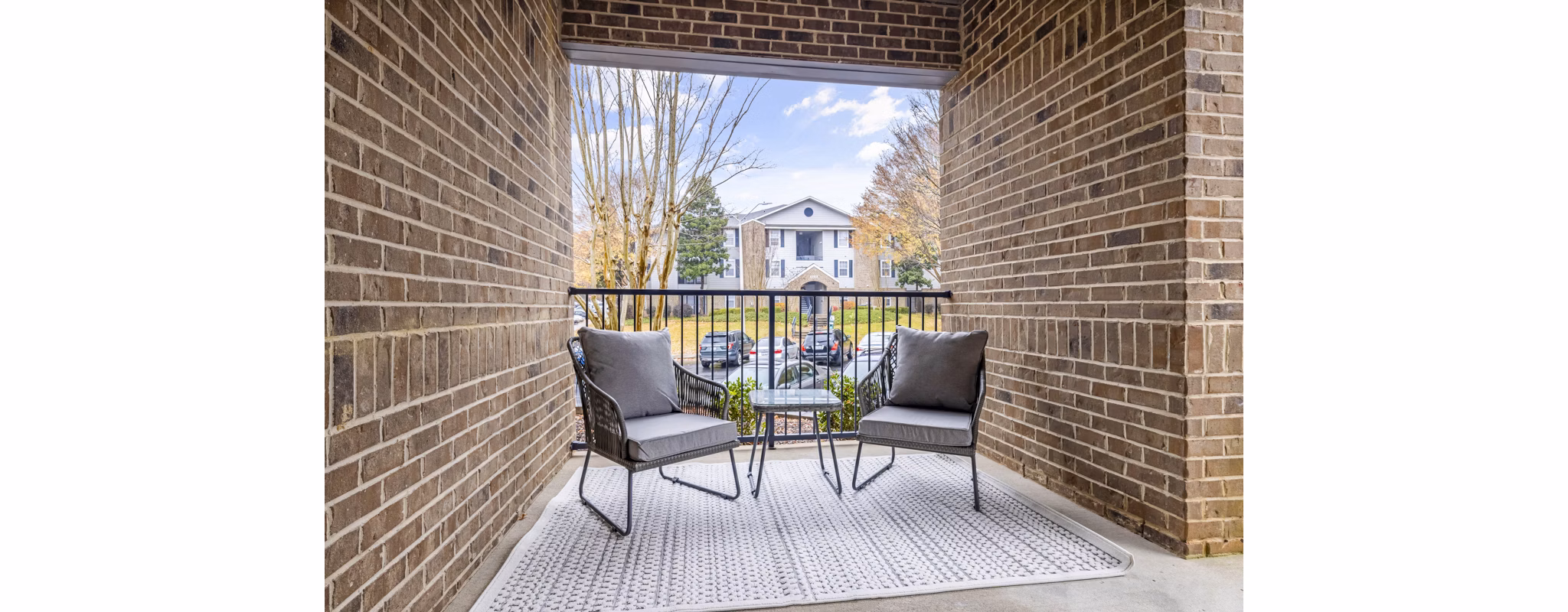 Private patio with scenic views at 403 West Apartments