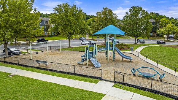 Playground featuring modern play equipment at 403 West Apartments, a luxury community for families to enjoy recreational activities