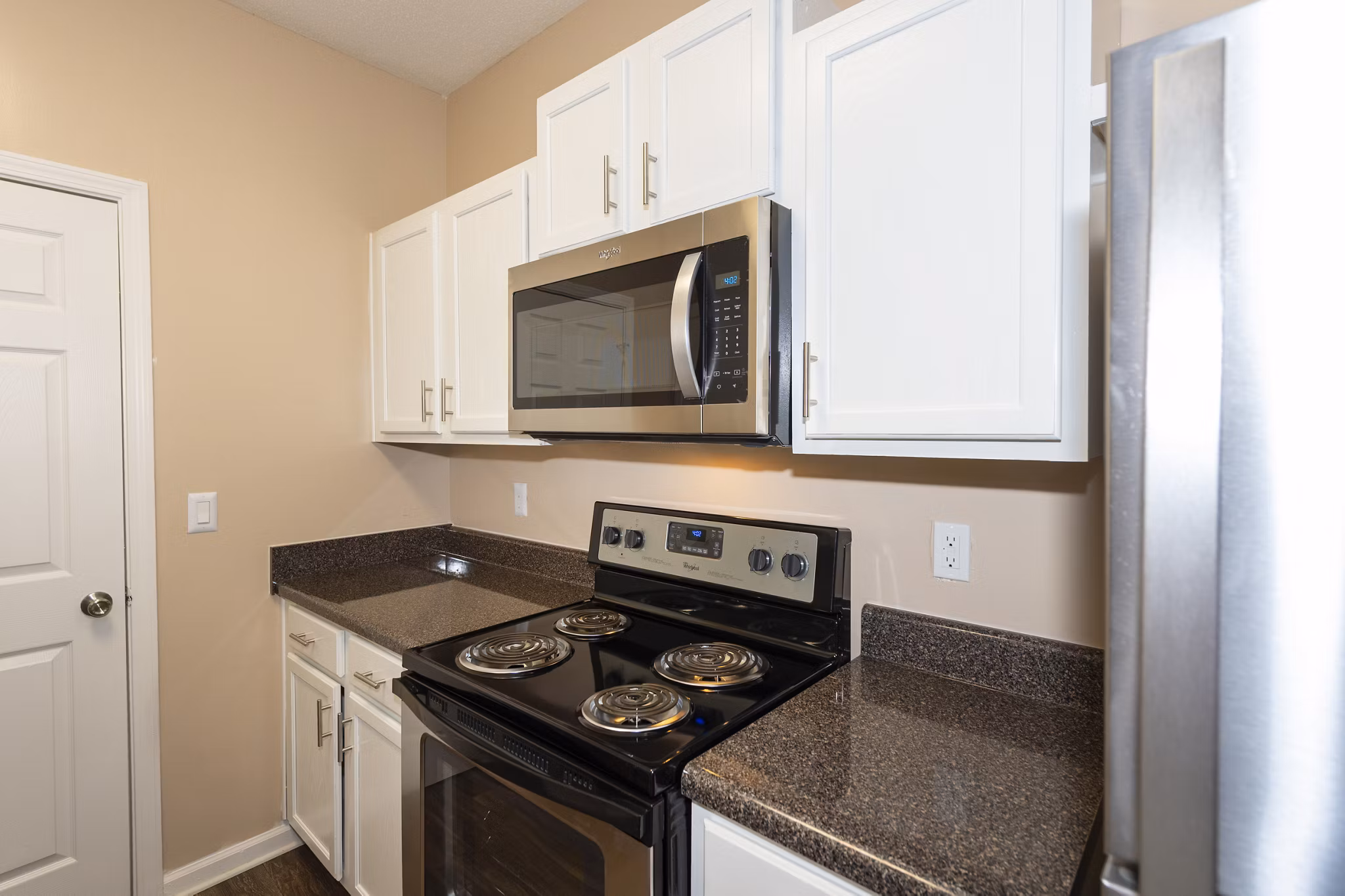 Modern kitchen with stainless steel appliances at Mainstreet at Conyers Apartments