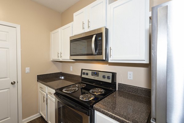 Modern kitchen with stainless steel appliances at Mainstreet at Conyers Apartments