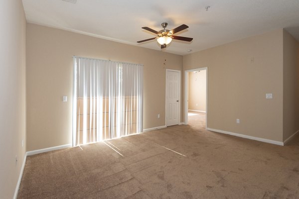 Spacious living room with modern furnishings in Mainstreet at Conyers Apartments