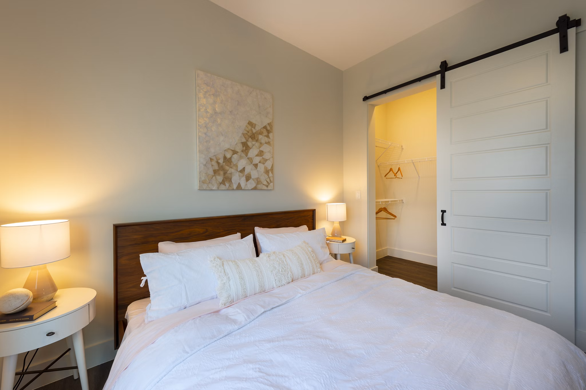 Bedroom with modern decor and large windows at Millennium Music Row Apartments, luxury living in Nashville