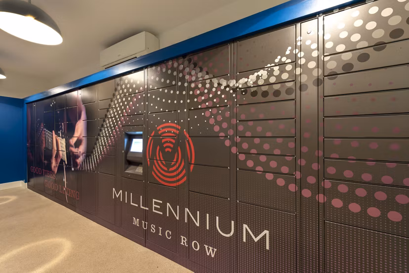Modern mail room with secure package lockers at Millennium Music Row Apartments