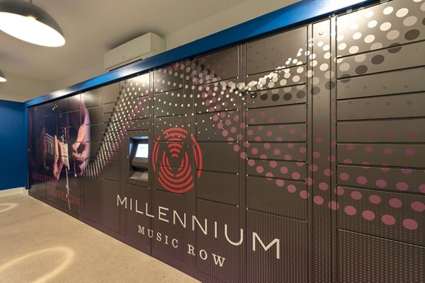 Modern mail room with secure package lockers at Millennium Music Row Apartments