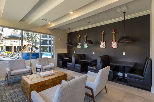 Clubhouse with modern decor and stylish seating at Millennium Music Row Apartments in Nashville
