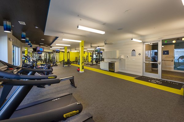 State-of-the-art fitness center at Millennium Music Row Apartments featuring modern equipment