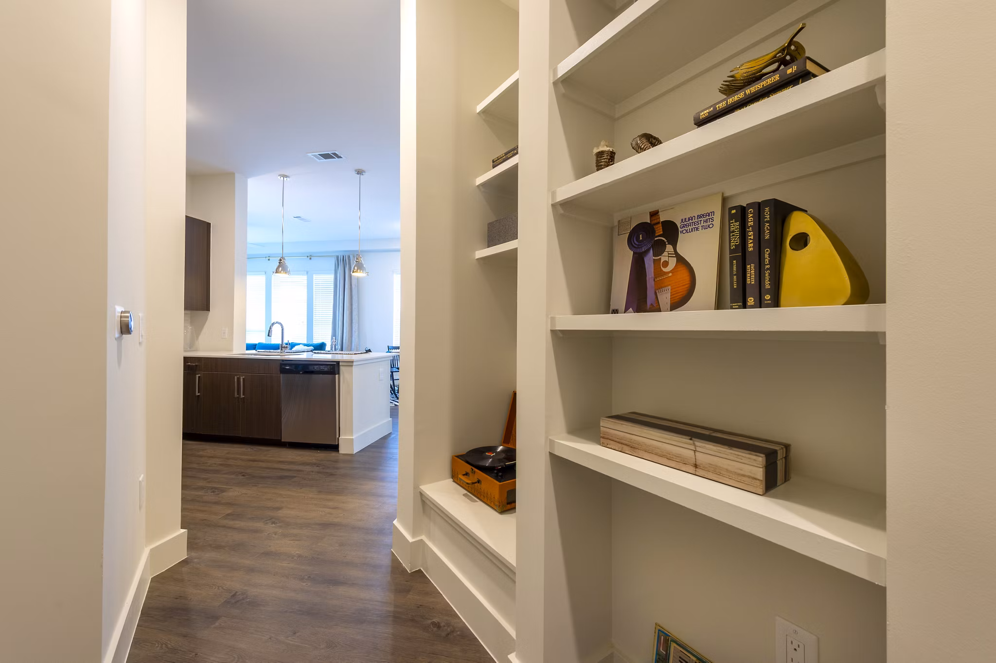 Elegant hallway with modern lighting at Millennium Music Row Apartments