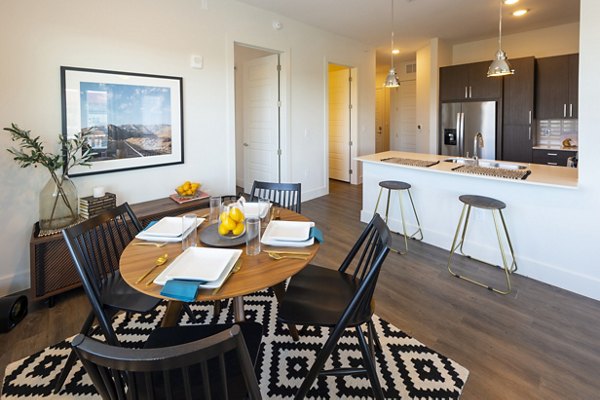 Modern kitchen with sleek appliances and granite countertops at Millennium Music Row Apartments
