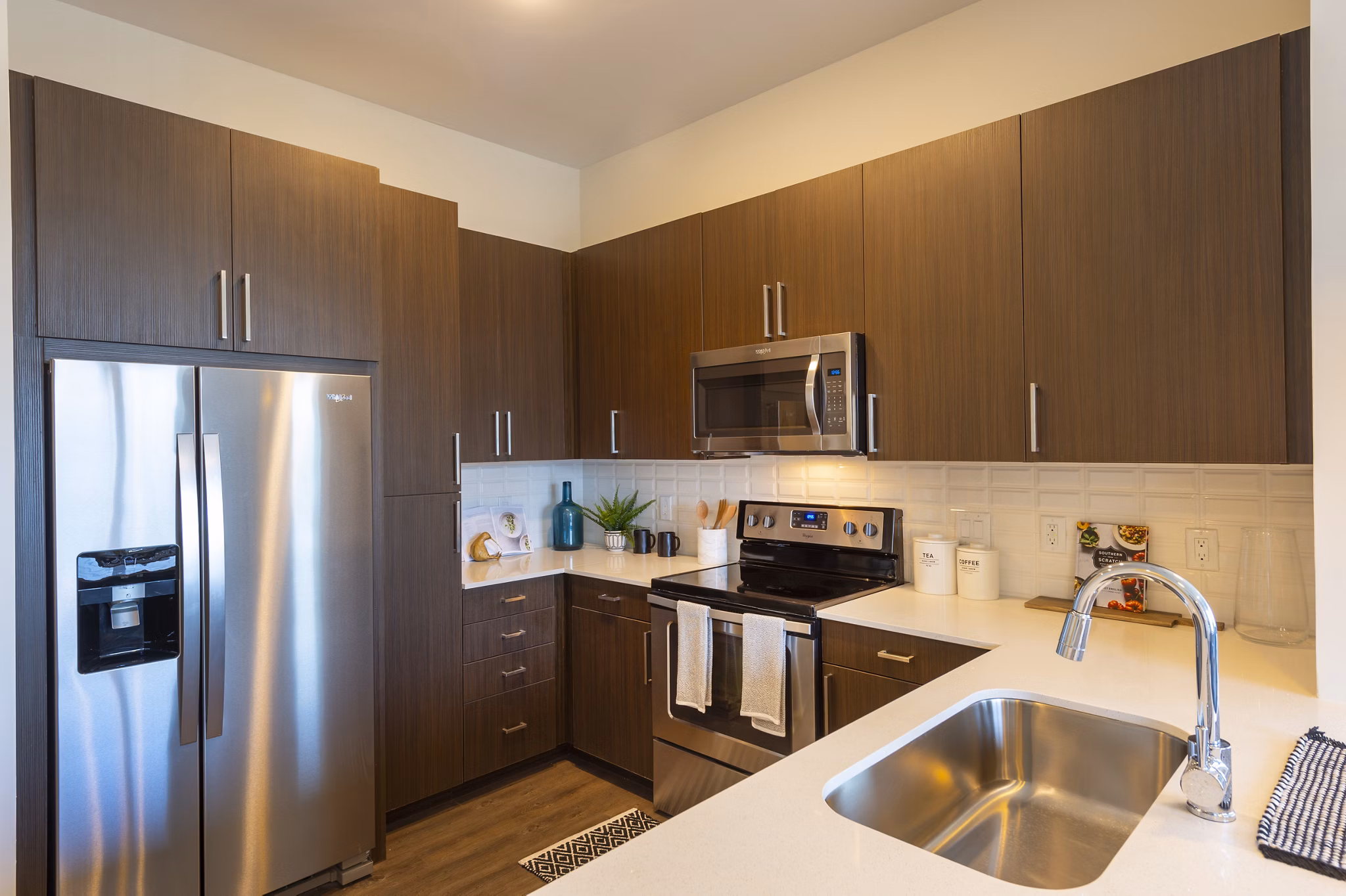Modern kitchen featuring stainless steel appliances at Millennium Music Row Apartments