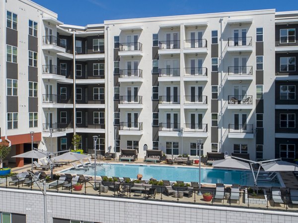 Rooftop infinity pool at Millennium Music Row Apartments with city skyline views