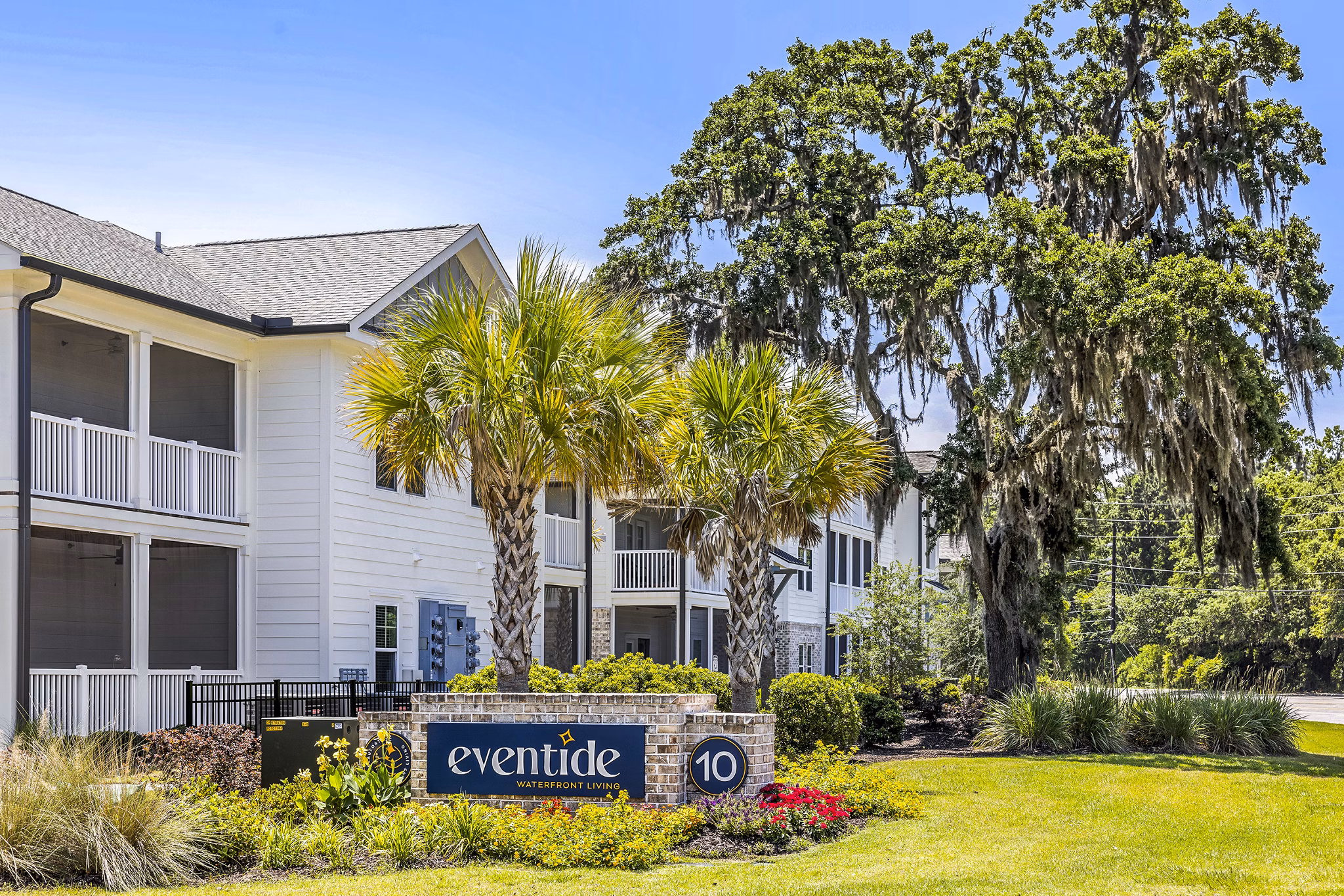 Eventide: Elegant luxury apartments surrounded by palm trees and landscaped gardens in a vibrant community