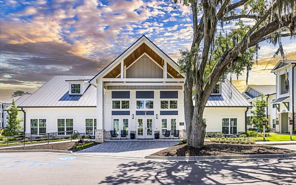 Eventide Apartments: Modern clubhouse with elegant decor and seating areas in 18385