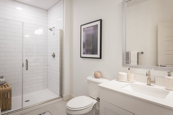 Modern bathroom with elegant fixtures at Everleigh Vernon Hills Apartments