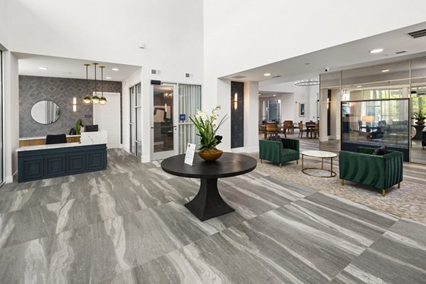 Clubhouse featuring modern decor and seating at Everleigh Vernon Hills Apartments