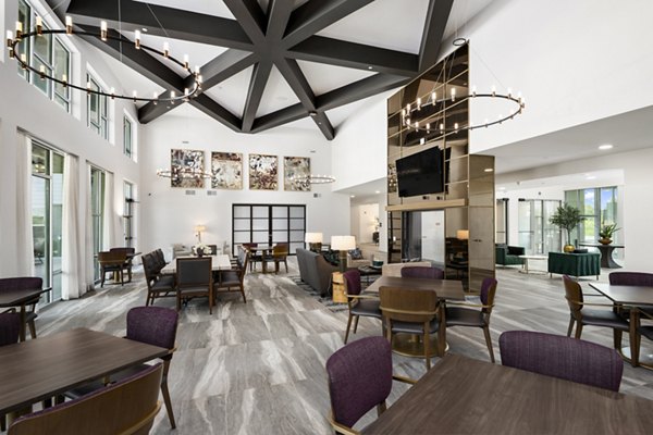 Upscale clubhouse with modern design at Everleigh Vernon Hills Apartments, offering residents a stylish social and recreational space