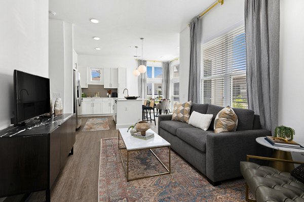 Living room with modern decor and ample natural light at Everleigh Vernon Hills Apartments