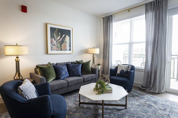 Modern living room with stylish decor and natural light at Everleigh Vernon Hills Apartments