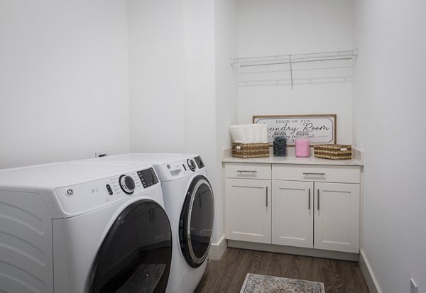 Laundry room with modern appliances in Everleigh Vernon Hills Apartments