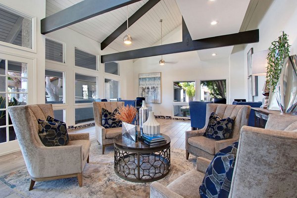 Clubhouse with modern furnishings and open seating at Avana Cordoba Apartments