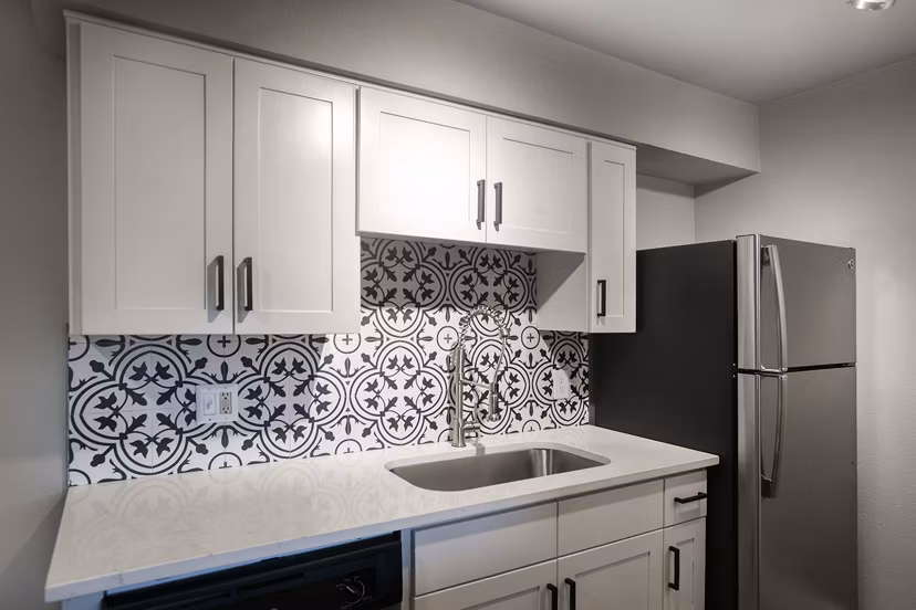 Sleek modern kitchen with stainless steel appliances at Avana Cordoba Apartments, a luxury community