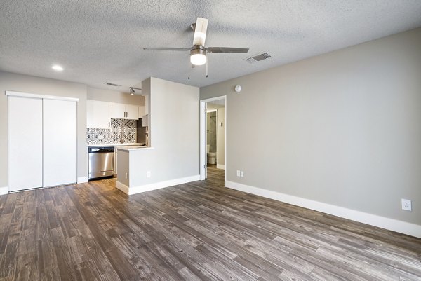 Spacious living room with modern furnishings at Avana Cordoba Apartments