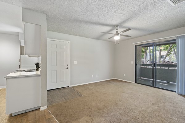 Inviting living room with modern decor and ample natural light at Avana Cordoba Apartments
