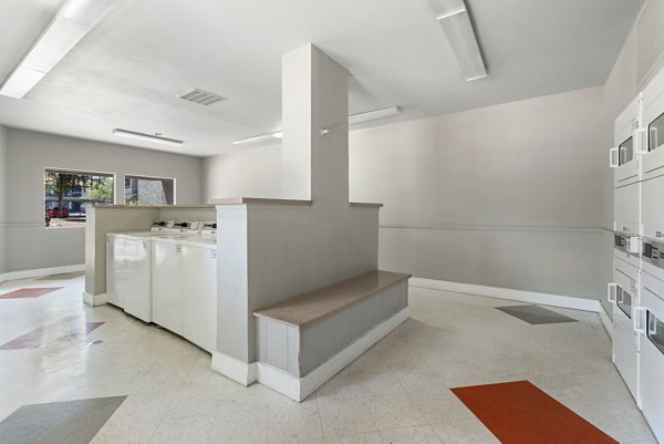 Modern laundry facility with high-efficiency machines at Avana Cordoba Apartments
