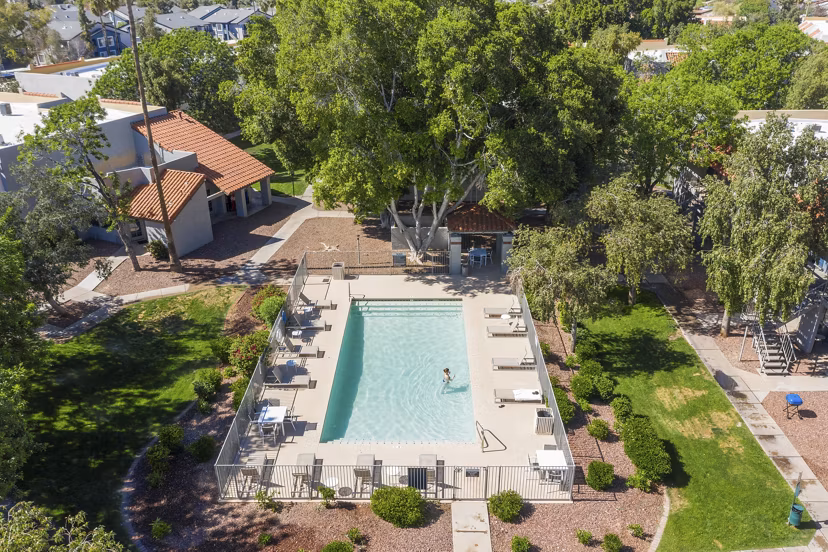 Tranquil pool area with lounge chairs at Avana Cordoba Apartments