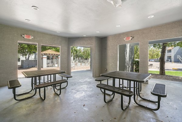 Cozy patio with seating area at Avana Cordoba Apartments, perfect for relaxing outdoors