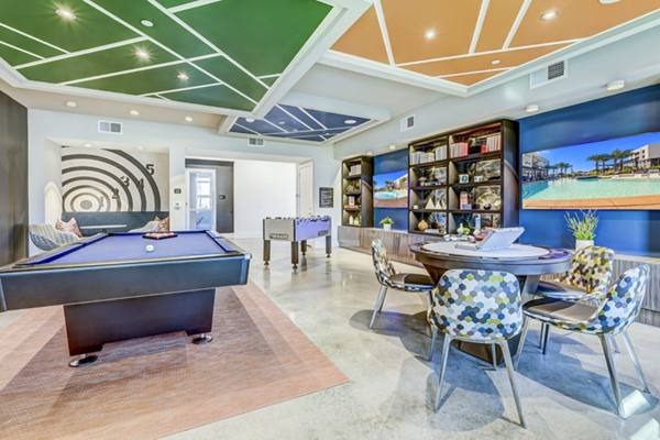 clubhouse game room at Encore Motif Apartments