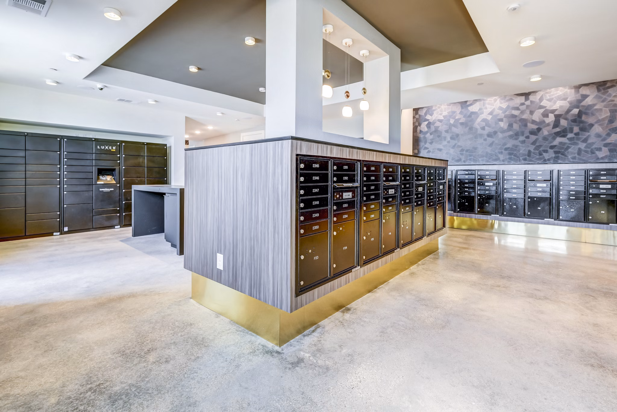 Modern mail room at Encore Motif Apartments featuring organized mail slots and package lockers