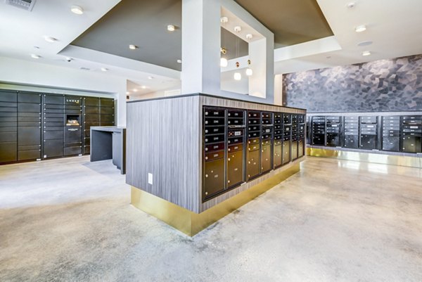 Modern mail room at Encore Motif Apartments featuring organized mail slots and package lockers