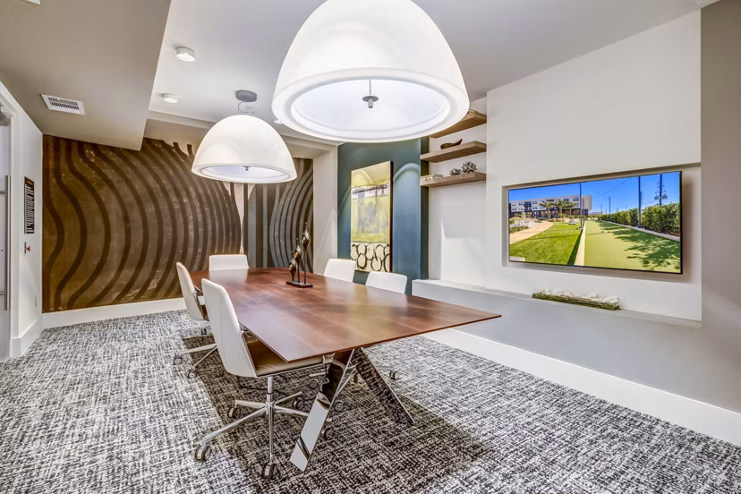 Clubhouse meeting facility with modern decor at Encore Motif Apartments providing a stylish space for gatherings and events