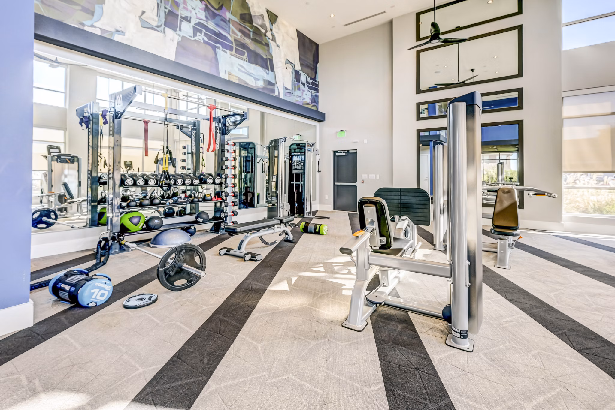 Modern fitness center with state-of-the-art equipment at Encore Motif Apartments, ideal for active lifestyles and wellness-focused residents